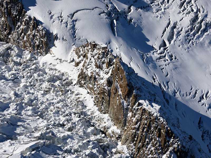 Aerial view. Photo of a mountain hut, Grands Mulets, Chamonix Mont-Blanc, Haute-Savoie, Auvergne-Rhône-Alpes, France. Vue aérienne.
