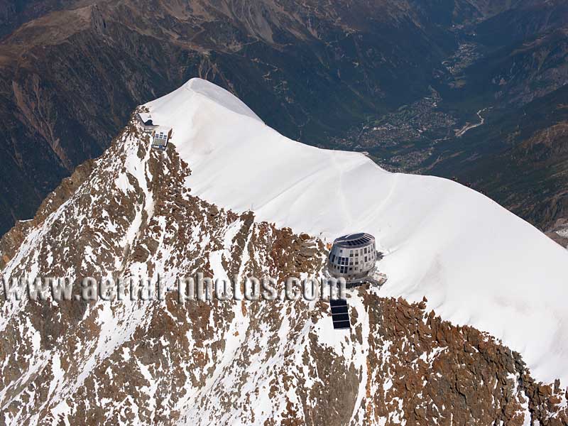 Aerial view. Photo of Aiguille du Goûter, Chamonix-Mont-Blanc, Haute-Savoie, Auvergne-Rhône-Alpes, France. Vue aérienne.