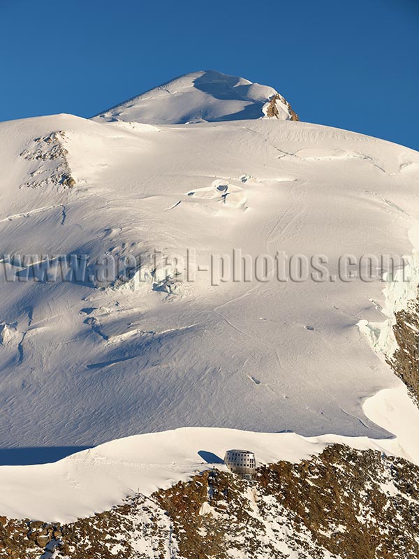 Aerial view. Photo of Refuge du Gouter. Chamonix-Mont-Blanc, Haute-Savoie, Auvergne-Rhône-Alpes, France. Vue aérienne.