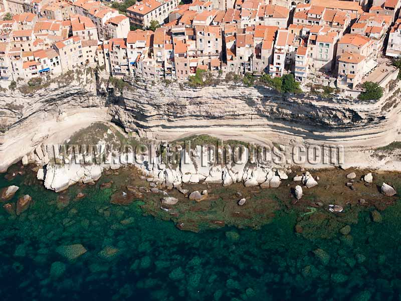 AERIAL VIEW photo of homes on a limestone cliff, Bonifacio, Corsica, France. VUE AERIENNE maisons au bord d'une falaise, Corse.