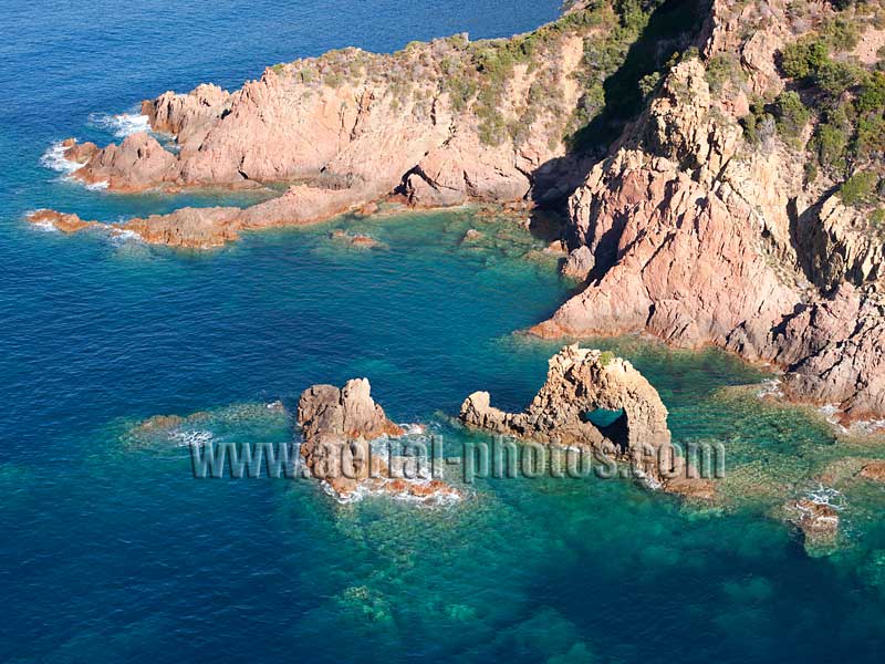 AERIAL VIEW photo of a volcanic rock arch, Porto Gulf, Corsica, France. VUE AERIENNE arche de roche volcanique, Porte d'Aix, Golfe de Porto, Corse.