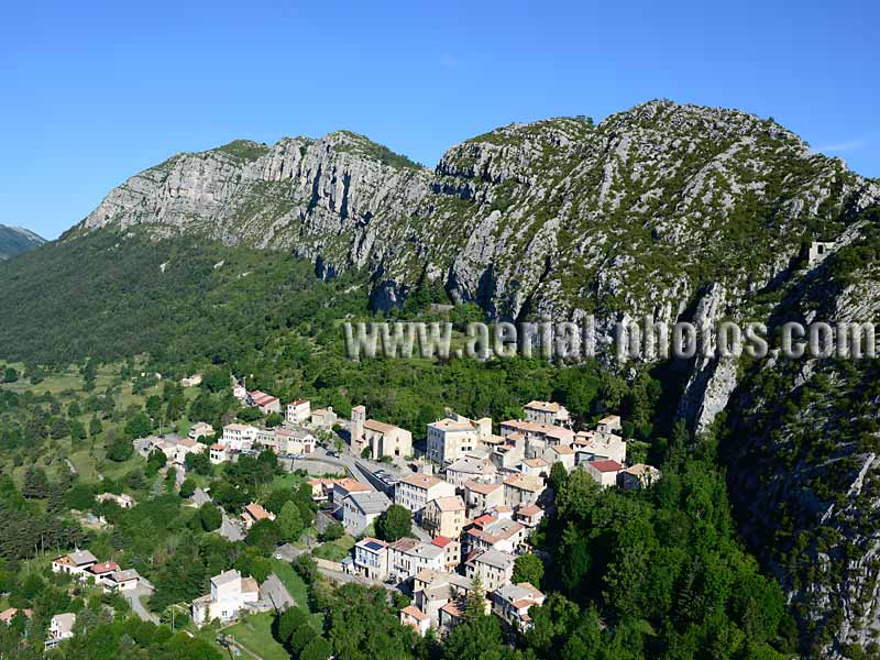 AERIAL VIEW photo of an hilltop town, Saint-Auban, French Alps, France. VUE AERIENNE village médiéval perché, Alpes Françaises.