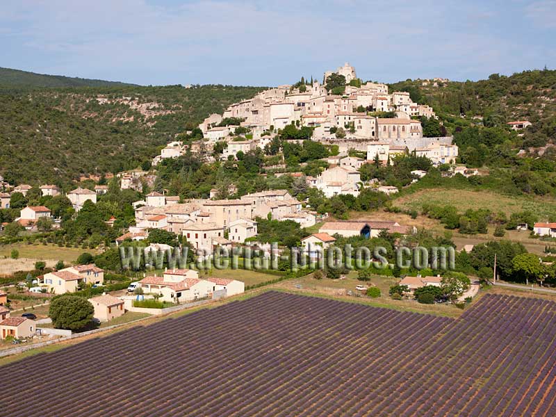 Aerial photo of Simiane-la-Rotonde, a hilltop village overlooking the lavender fields in Provence, France. Vue aérienne.