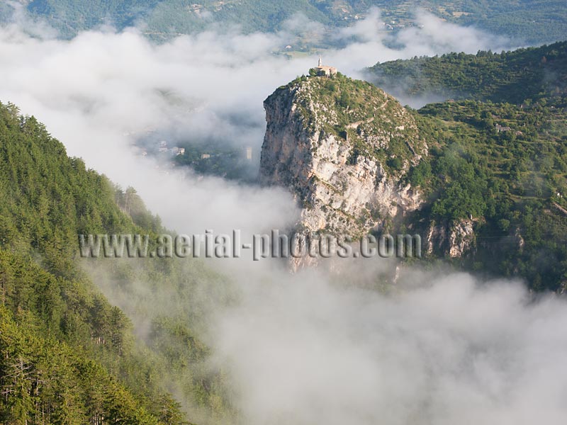 AERIAL VIEW photo of a chapel above the fog, Castellane, Provence, France. VUE AERIENNE au dessus du brouillard, chapelle de Castellane.