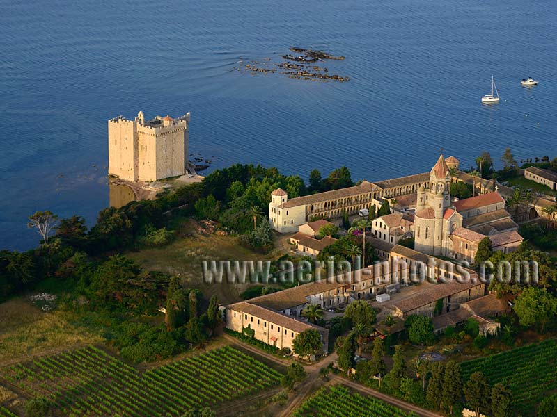 AERIAL VIEW photo of Lérins Abbey, Saint-Honorat Island, Lérins Islands, Cannes, French Riviera, France. VUE AERIENNE abbaye de Lérins, Île Saint-Honorat, Îles de Lérins, Côte d'Azur, Alpes-Maritimes.