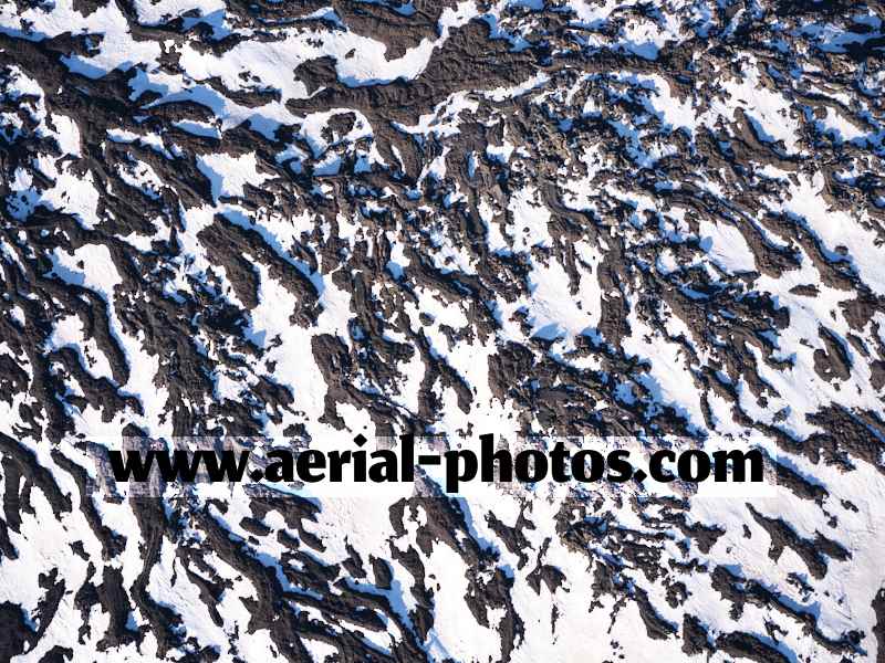 Aerial view, snow and lava on Mount Etna, Sicily, Italy. VEDUTA AEREA foto, Monte Etna, Italia.