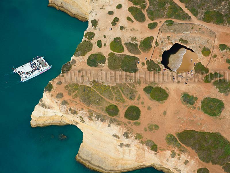 AERIAL VIEW photo of a sea cave, Algar de Benagil, Lagoa, Algarve, Portugal. VISTA AEREA.