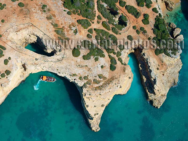 AERIAL VIEW photo of a sea cave, Albandeira beach, Lagoa, Algarve, Portugal. VISTA AEREA praia de Albandeira.